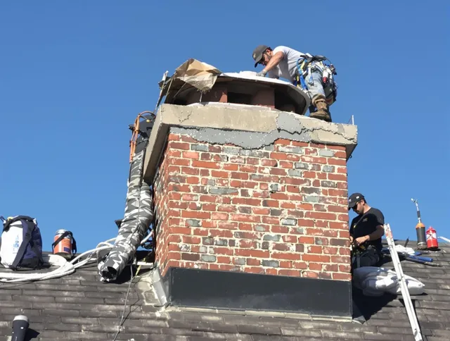 Beverly Hills Chimney Sweep installing a custom chimney crown in Beverly Hills, CA