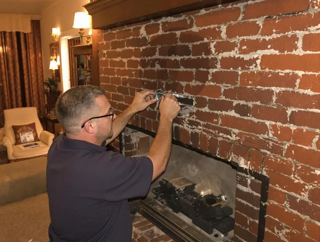 Beverly Hills Chimney Sweep expert fixing a fireplace in Beverly Hills, CA